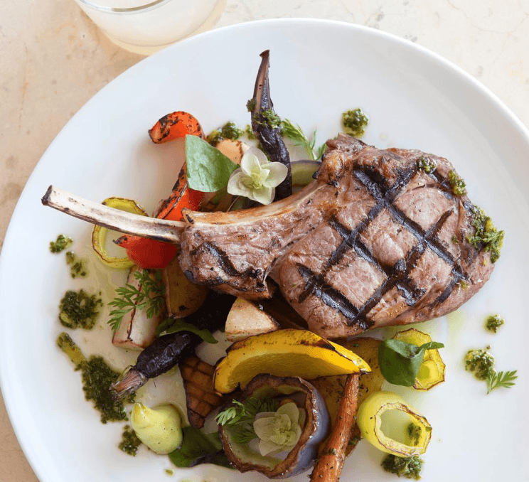 protein on plate with roasted vegetables