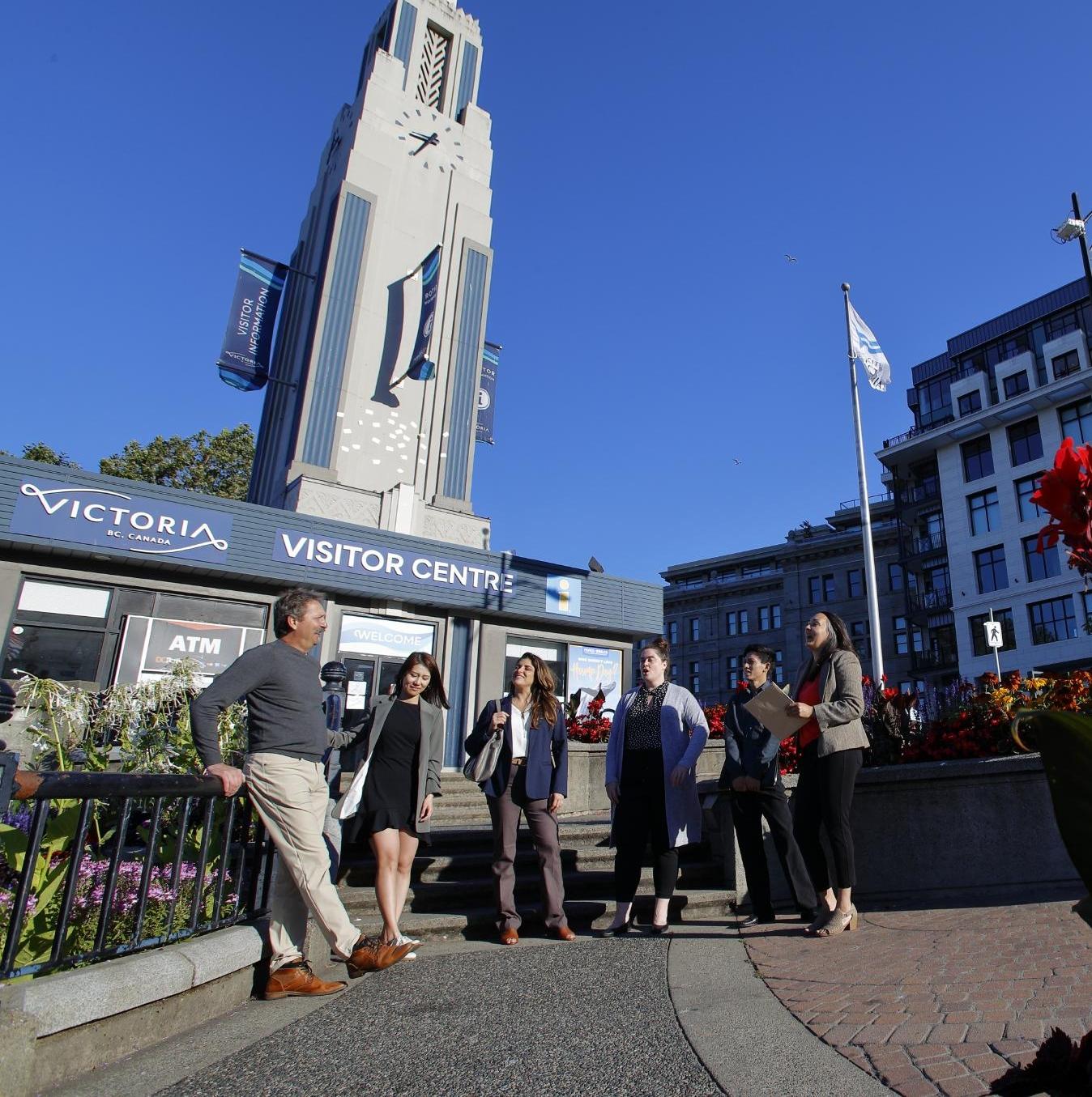six people standing out front of the visitor centre